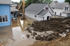 Minot emergency workers patch Broadway levee