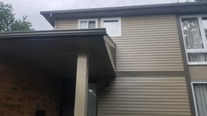 aluminum siding soffit and fascia connection under roof overhang