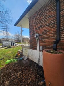 rain barrels connected to eavestrough downpipe