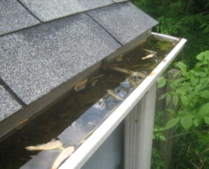 clogged eavestrough full of water 1