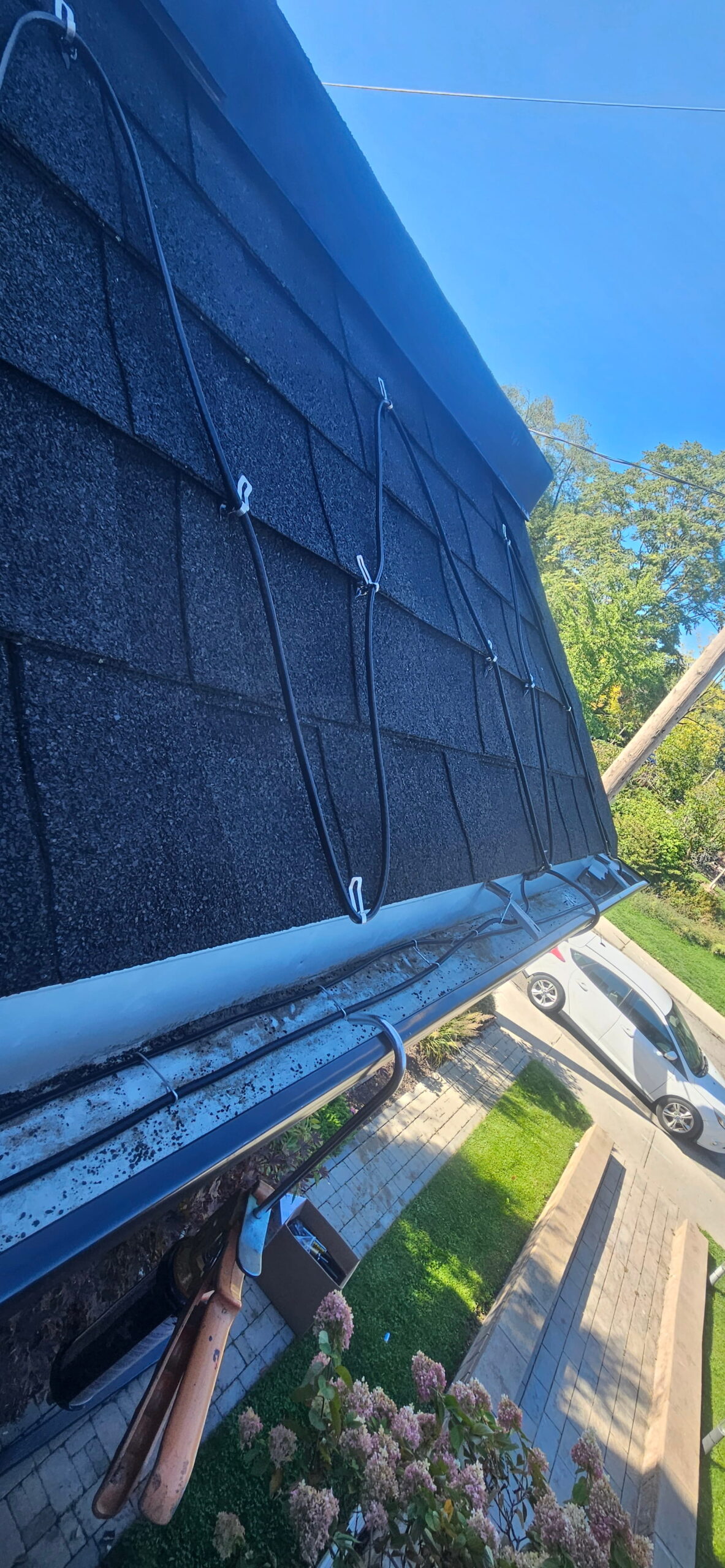 roof de icing cable installed along eavestrough to prevent ice dams
