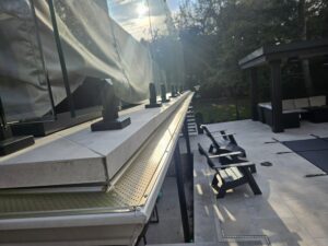 Leaf guard system installed over eavestrough along roofline