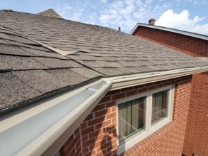 drip edge installed along roofline above eavestrough on brick home