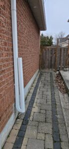 downspout replacement along side yard in Mississauga home
