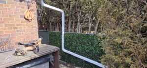 downspout connected to gutter system in Oakville home