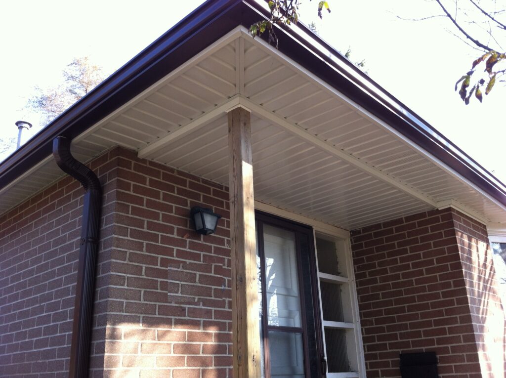 Aluminum soffit and fascia installation on residential roofline