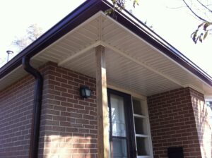 Aluminum soffit and fascia installation on residential roofline