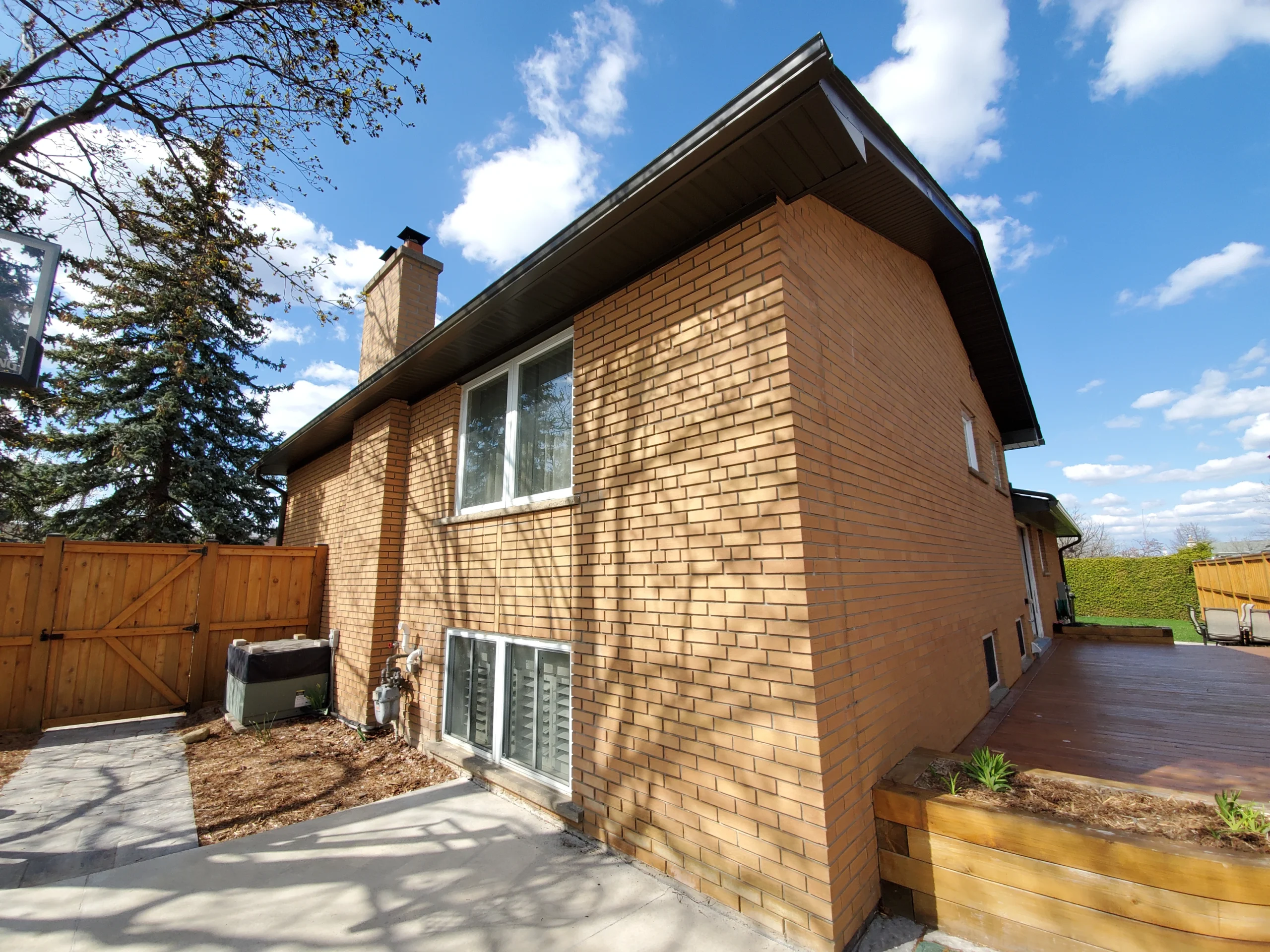 Seamless eavestrough installation on residential home by Century Aluminum