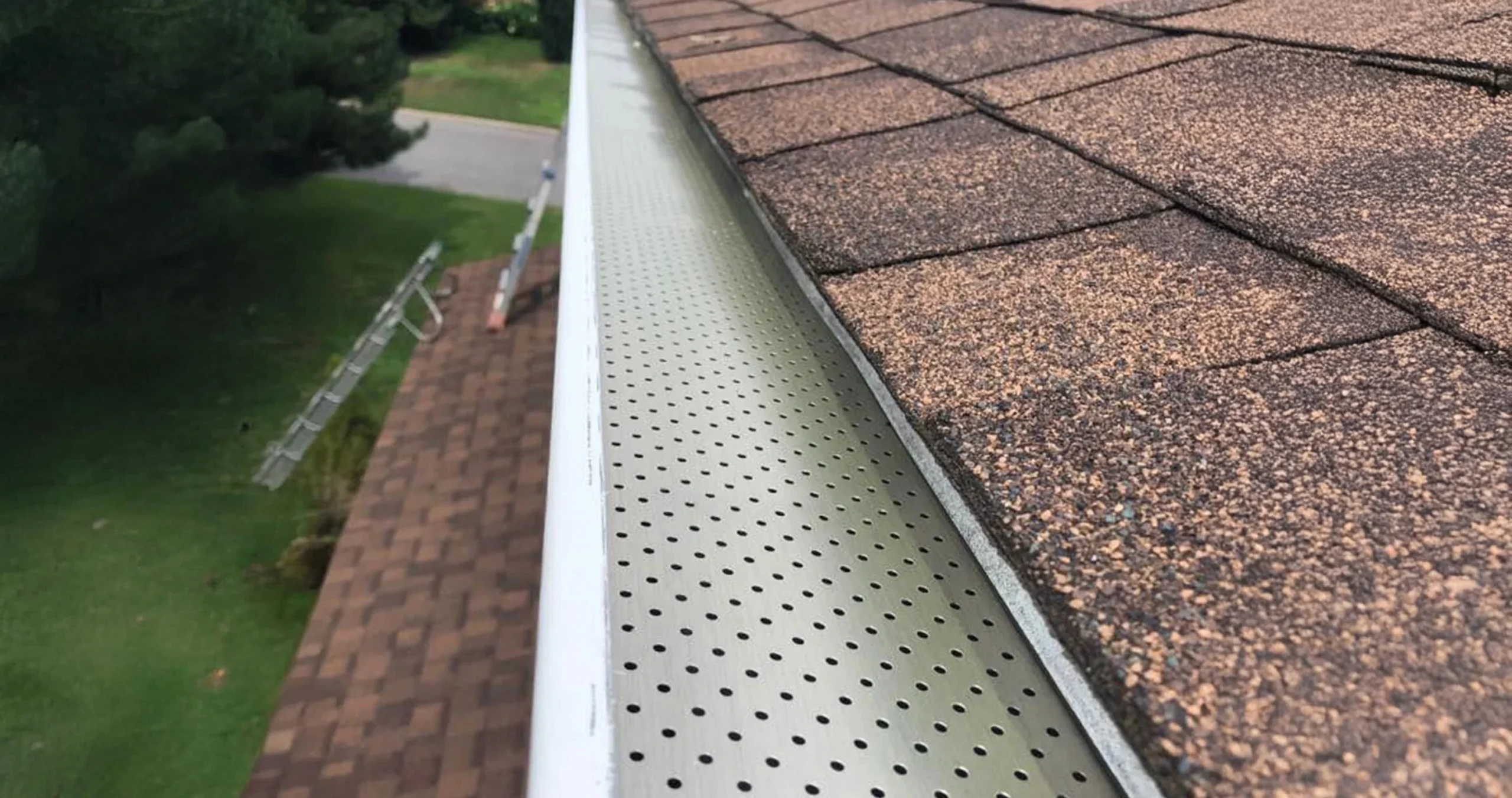 Trex leafguard installed along new gutters, ensuring a neat and efficient water flow.