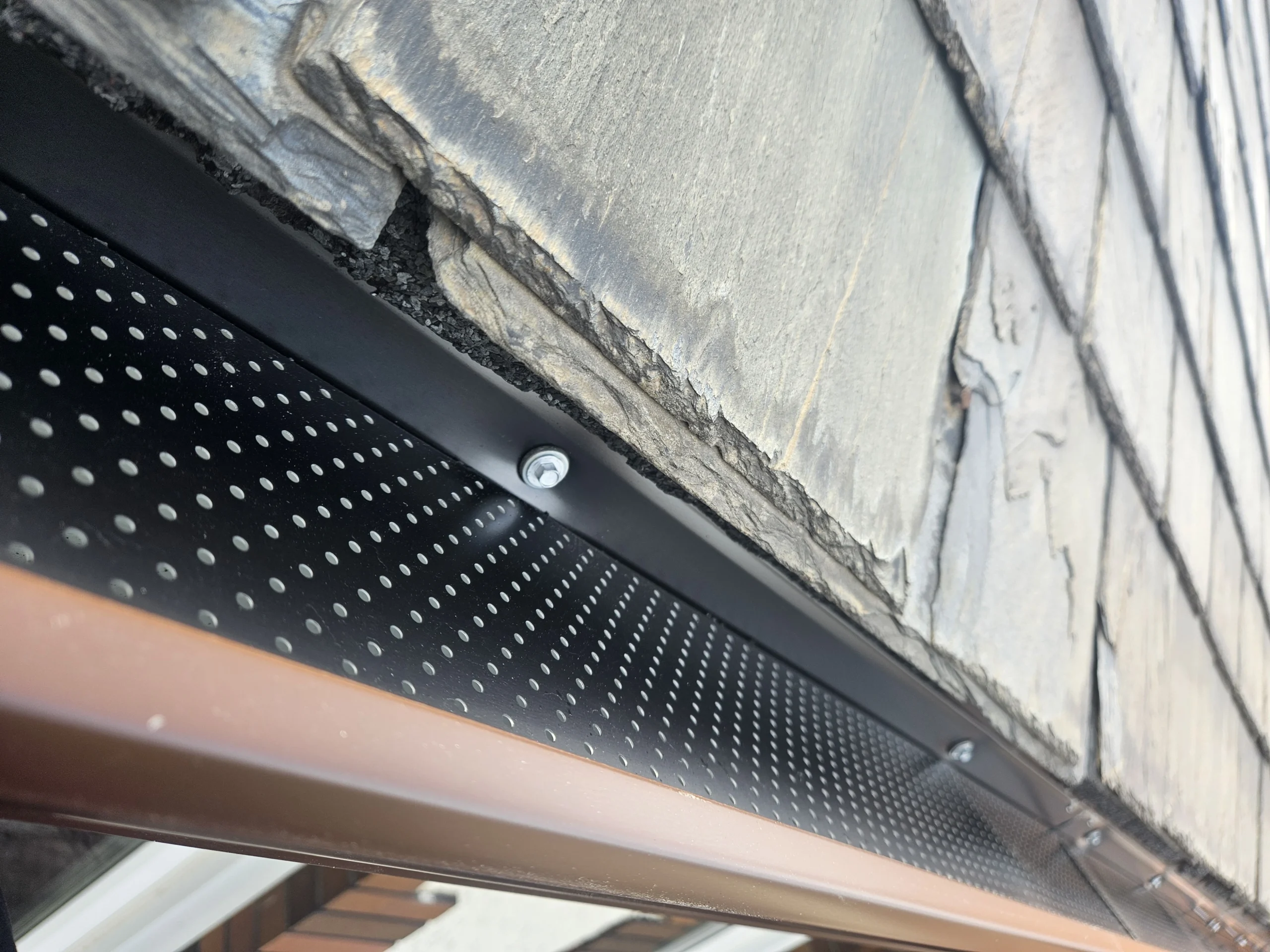 Alu-Rex gutter guard system installed on residential eavestrough
